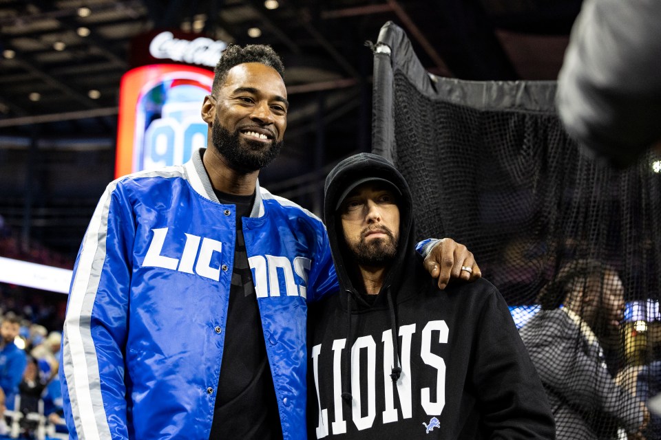 DETROIT, MICHIGAN - JANUARY 14: Former Detroit Lions player Calvin Johnson poses for a photo with Eminem before the Lions home game against the Los Angeles Rams at Ford Field on January 14, 2024 in Detroit, Michigan. The Lions beat the Rams 24-23. (Photo by Lauren Leigh Bacho/Getty Images)