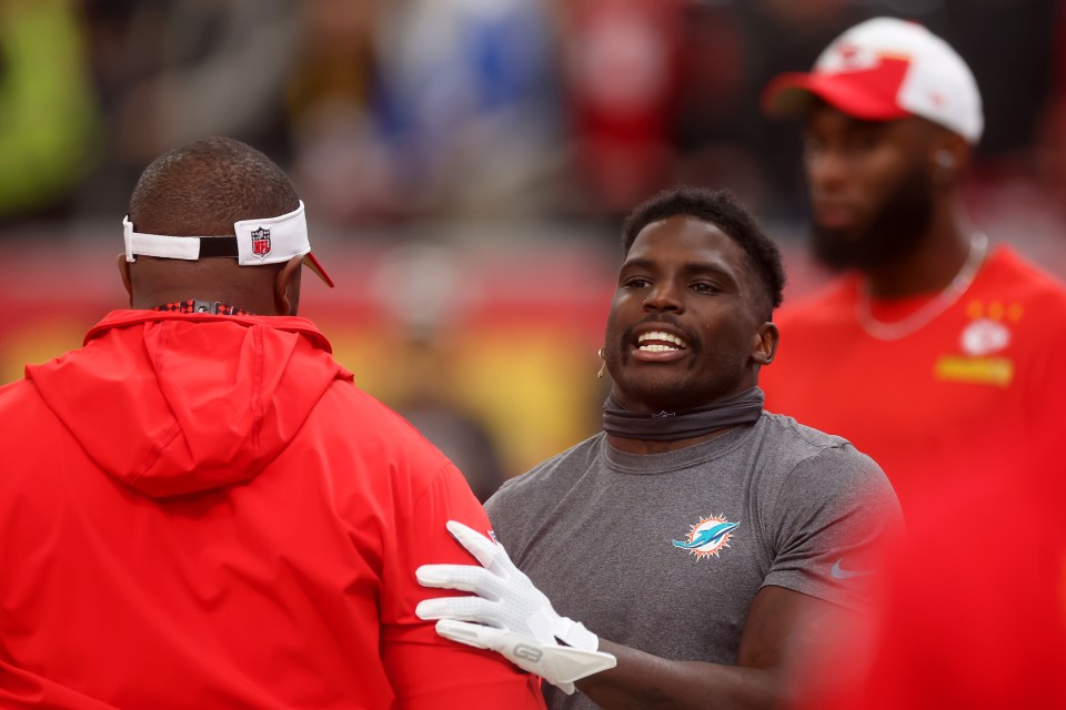 FRANKFURT AM MAIN, GERMANY - NOVEMBER 05: Tyreek Hill #10 of the Miami Dolphins interacts with Kansas City Chiefs staff prior to the NFL match between Miami Dolphins and Kansas City Chiefs at Deutsche Bank Park on November 05, 2023 in Frankfurt am Main, Germany. (Photo by Alex Grimm/Getty Images)