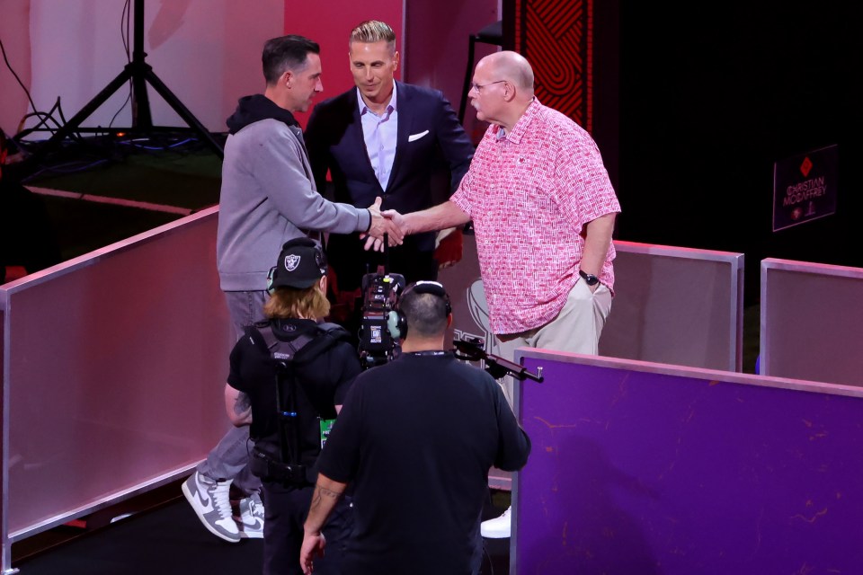 LAS VEGAS, NEVADA - FEBRUARY 05: Head coach Kyle Shanahan of the San Francisco 49ers (L) and head coach Andy Reid of the Kansas City Chiefs meet during Super Bowl LVIII Opening Night at Allegiant Stadium on February 05, 2024 in Las Vegas, Nevada. (Photo by Ethan Miller/Getty Images)