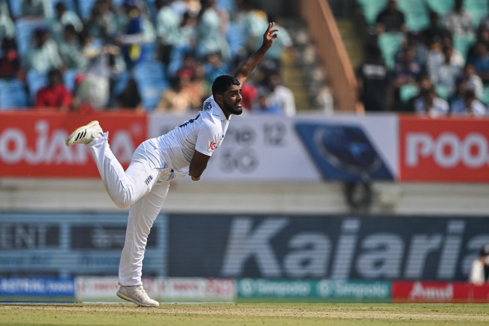 TOPSHOT - England's Rehan Ahmed delivers a ball during the third Test cricket match between India and England at Niranjan Shah stadium in Rajkot on February 15, 2024. (Photo by Punit PARANJPE / AFP) / -- IMAGE RESTRICTED TO EDITORIAL USE - STRICTLY NO COMMERCIAL USE -- (Photo by PUNIT PARANJPE/AFP via Getty Images)