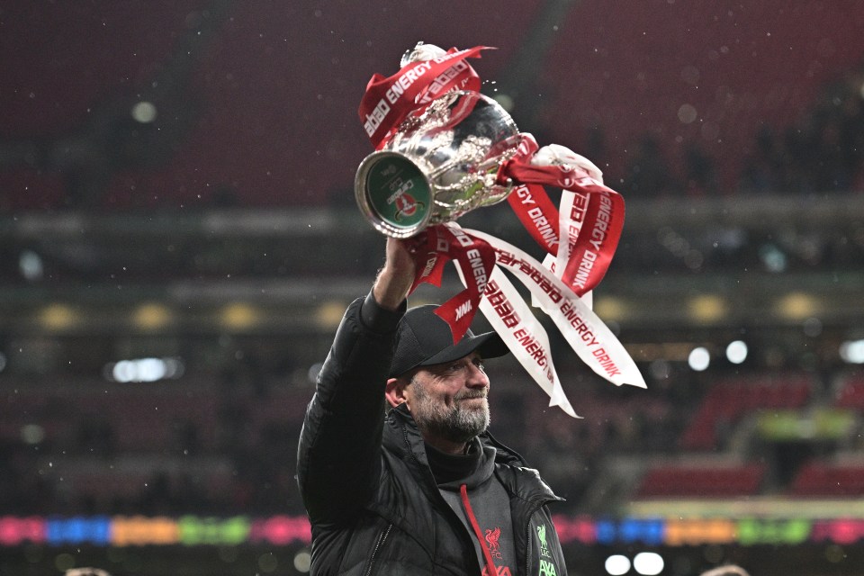LONDON, ENGLAND - FEBRUARY 25: JÃ¼rgen Klopp, the manager of Liverpool FC celebrates with the trophy after winning the Carabao Cup after the Carabao Cup Final match between Chelsea and Liverpool at Wembley Stadium on February 25, 2024 in London, England. (Photo by Sebastian Frej/MB Media/Getty Images)