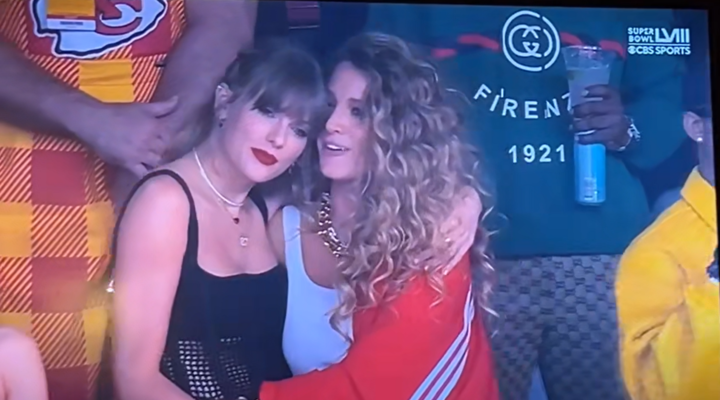 Taylor watches Post Malone's performance alongside the her Hollywood pal