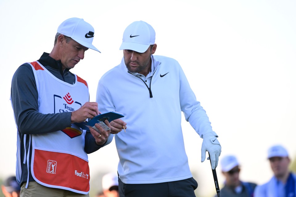 HOUSTON, TEXAS - MARCH 28: Scottie Scheffler of the United States and his caddie line up a shot from the 12th tee during the first round of the Texas Children's Houston Open at Memorial Park Golf Course on March 28, 2024 in Houston, Texas. (Photo by Logan Riely/Getty Images)
