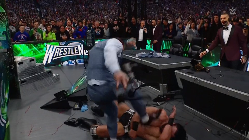CM Punk put the boot into McIntyre at ringside before Damian Priest arrived to stun McIntyre and steal his newly-won title