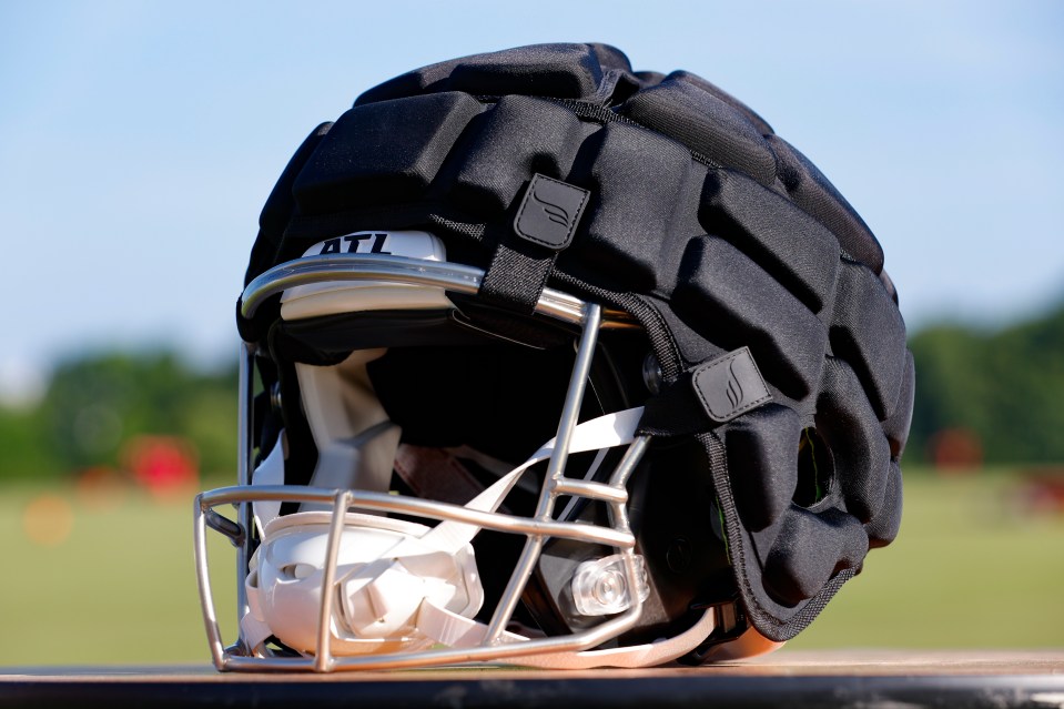 The heavily padded and protective gear is attached to the outside of a normal NFL helmet