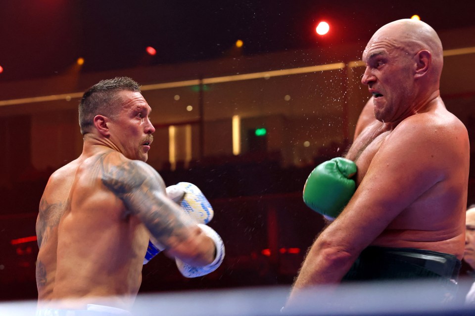 Ukraine's Oleksandr Usyk (L) fights against Britain's Tyson Fury during a heavyweight boxing world championship fight at Kingdom Arena in Riyadh, Saudi Arabia on May 19, 2024. Oleksandr Usyk beat Tyson Fury by split decision to win the world's first undisputed heavyweight championship in 25 years on May 19, 2024, an unprecedented feat in boxing's four-belt era. (Photo by Fayez NURELDINE / AFP) (Photo by FAYEZ NURELDINE/AFP via Getty Images)