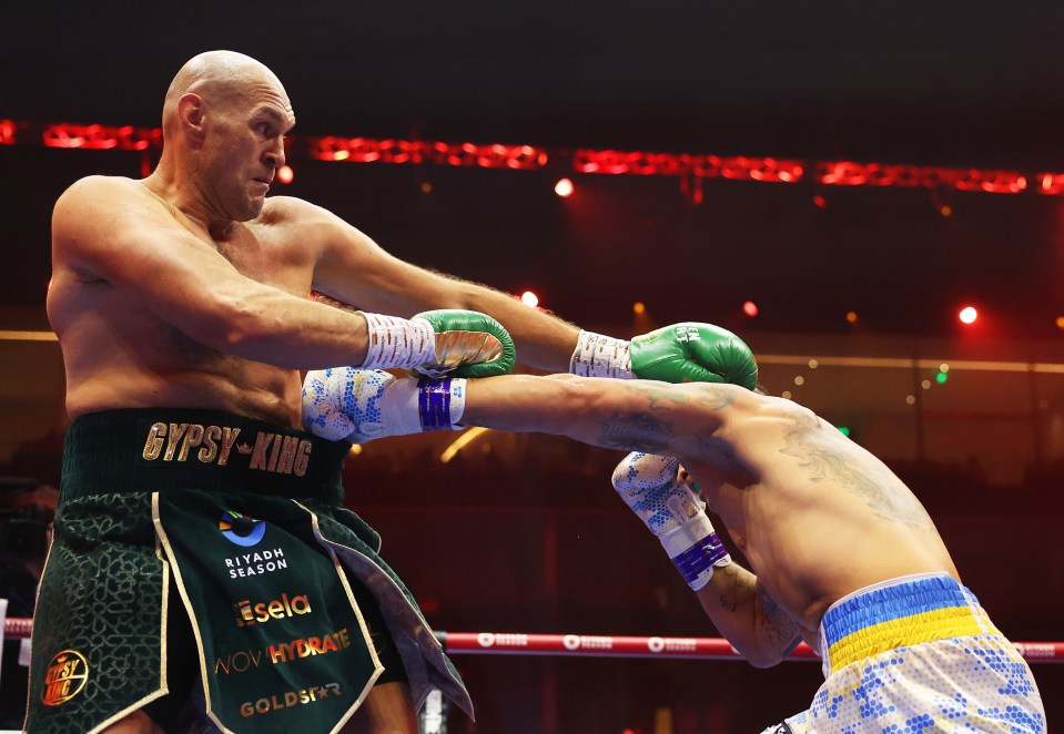 RIYADH, SAUDI ARABIA - MAY 18: Tyson Fury and Oleksandr Usyk exchange punches during the IBF, WBA, WBC, WBO and Undisputed Heavyweight titles' fight between Tyson Fury and Oleksandr Usyk at Kingdom Arena on May 18, 2024 in Riyadh, Saudi Arabia. (Photo by Richard Pelham/Getty Images)