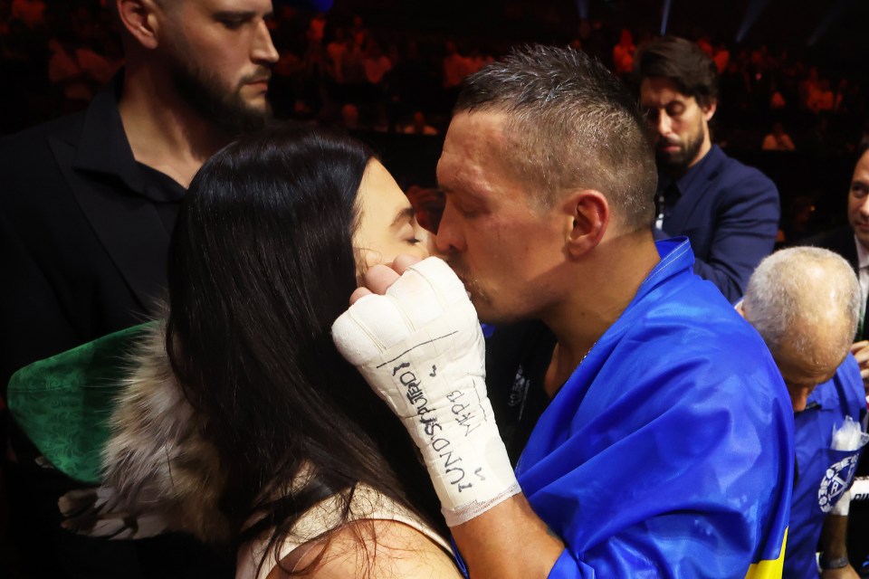 RIYADH, SAUDI ARABIA - MAY 18: Oleksandr Usyk kisses his wife, Yekaterina Usyk, following victory over Tyson Fury (not pictured) in the IBF, WBA, WBC, WBO and Undisputed Heavyweight titles' fight between Tyson Fury and Oleksandr Usyk at Kingdom Arena on May 18, 2024 in Riyadh, Saudi Arabia. (Photo by Richard Pelham/Getty Images)