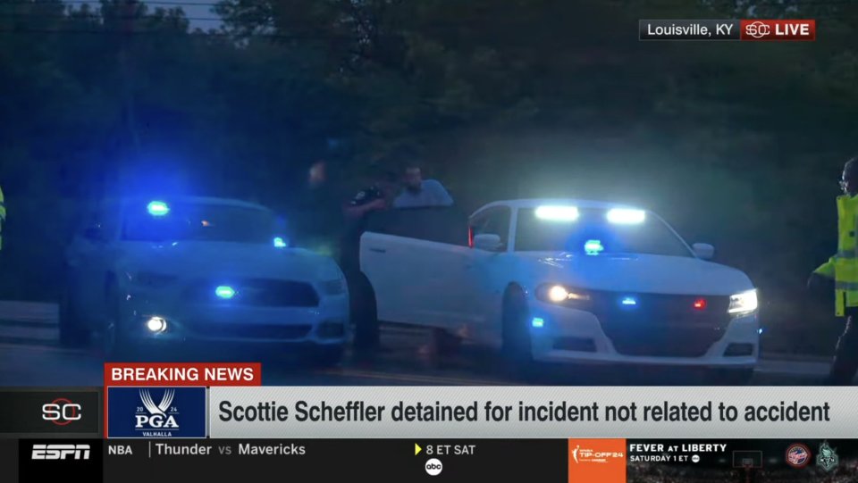 A chaotic scene saw Scheffler being handcuffed in the early morning Friday