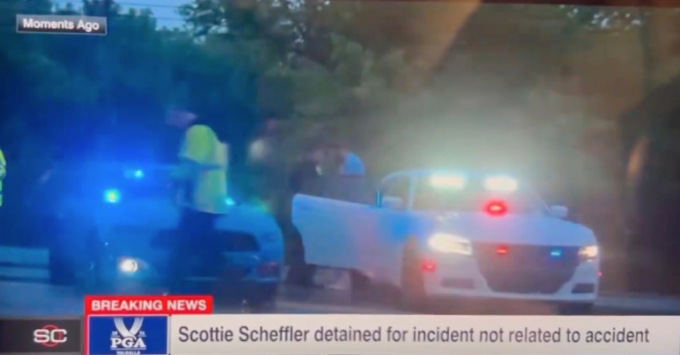 Scheffler was then placed in a car before being driven away