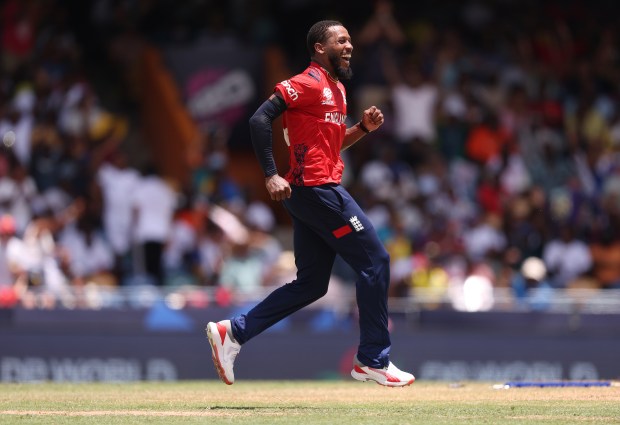 BRIDGETOWN, BARBADOS - JUNE 23: Chris Jordan of England celebrates the wicket of Saurabh Netravalkar of USA to complete a hat trick during the ICC Men's T20 Cricket World Cup West Indies &amp; USA 2024 Super Eight match between USA and England at Kensington Oval on June 23, 2024 in Bridgetown, Barbados. (Photo by Robert Cianflone/Getty Images)