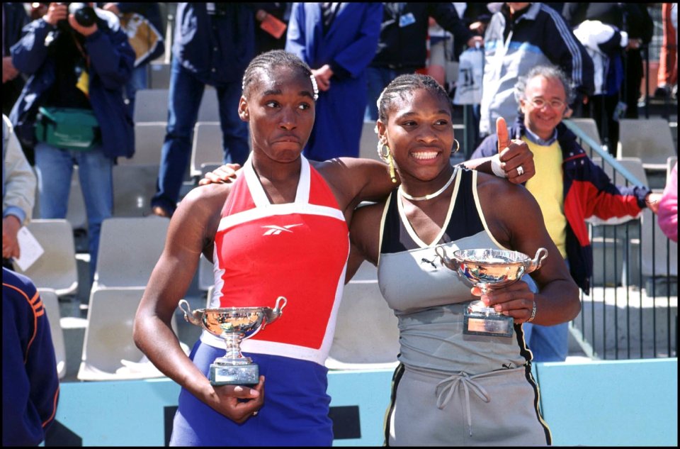 1999 French Open Doubles Champions Venus and Serena Williams with their trophies at Roland Garros, Paris, France. (Photo by Art SEITZ/Gamma-Rapho via Getty Images)