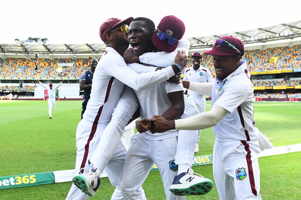BRISBANE, AUSTRALIA - JANUARY 28: Shamar Joseph of West Indies celebrates with team mates after dismissing Josh Hazlewood of Australia and giving West Indies the victory during day four of the Second Test match in the series between Australia and West Indies at The Gabba on January 28, 2024 in Brisbane, Australia. (Photo by Albert Perez - CA/Cricket Australia via Getty Images)