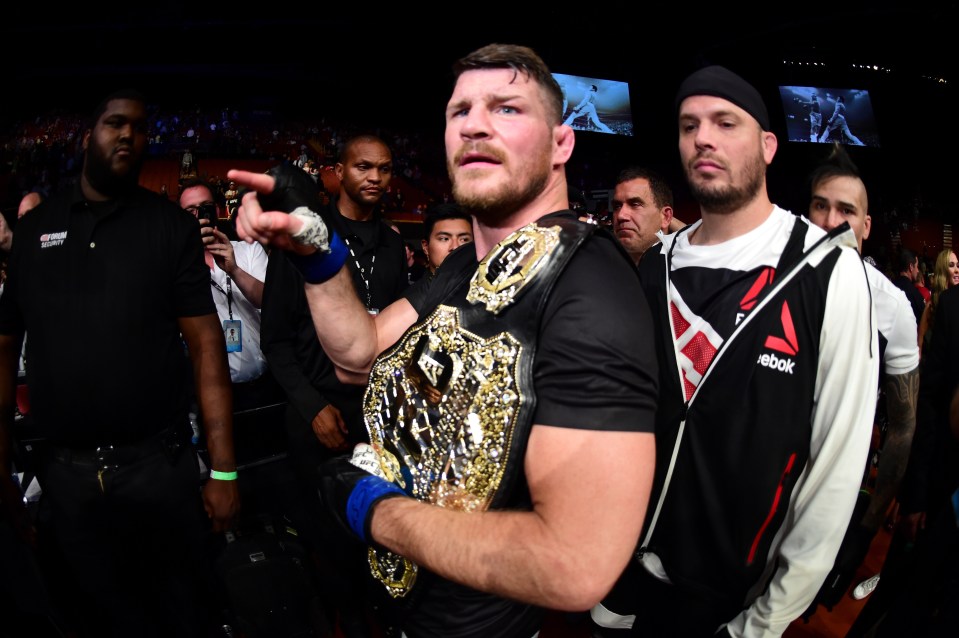 INGLEWOOD, CA - JUNE 04: Michael Bisping of England stands with his title belt after his first round knockout win against Luke Rockhold in their UFC middleweight championship bout during the UFC 199 event at The Forum on June 4, 2016 in Inglewood, California.  (Photo by Harry How/Zuffa LLC/Zuffa LLC via Getty Images)