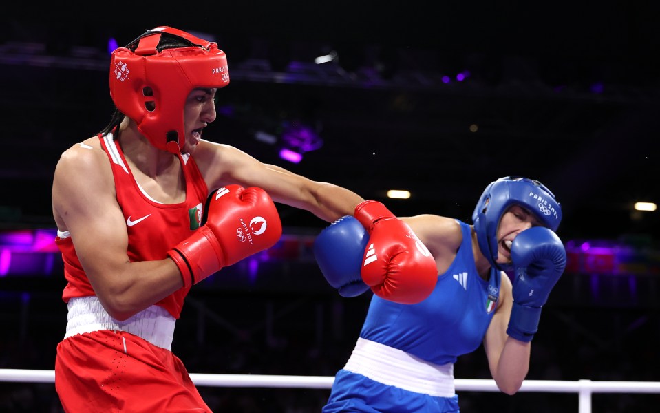 PARIS, FRANCE - AUGUST 01: Imane Khelif of Team Algeria and Angela Carini of Team Italy exchange punches during the Women's 66kg preliminary round match on day six of the Olympic Games Paris 2024 at North Paris Arena on August 01, 2024 in Paris, France. (Photo by Richard Pelham/Getty Images)