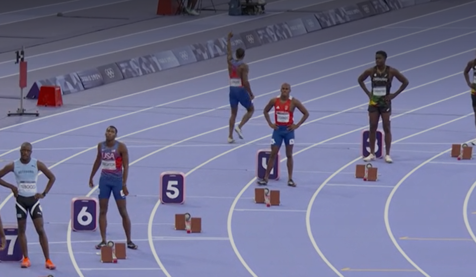 Lyles jumped around the track and engaged with fans before running