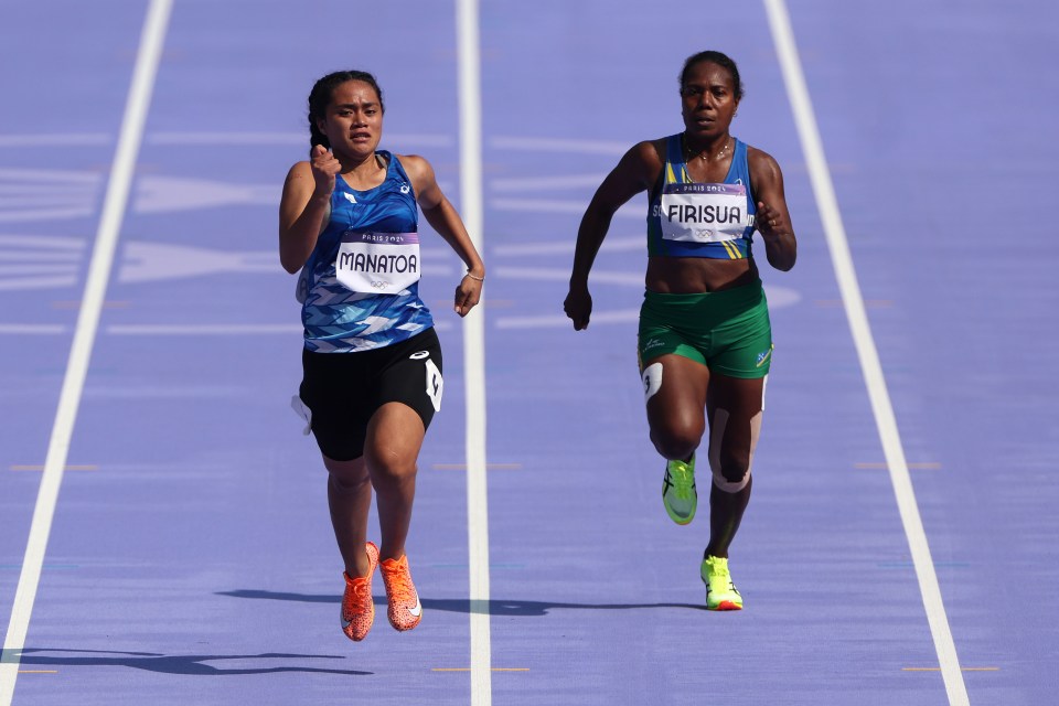 Firisua (right) ran a much shorter distance than what she's used to at these Games