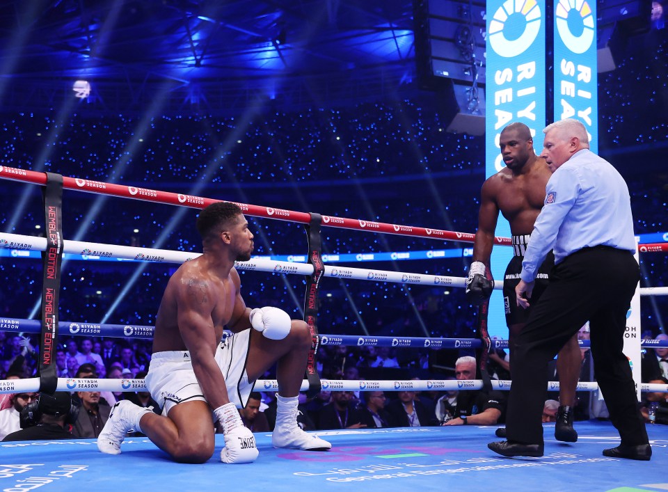 LONDON, ENGLAND - SEPTEMBER 21: Anthony Joshua reacts after being knocked down by Daniel Dubois during the IBF World Heavyweight Title fight between Daniel Dubois and Anthony Joshua, on the Riyadh Season  - Wembley Edition card at Wembley Stadium on September 21, 2024 in London, England. (Photo by Richard Pelham/Getty Images)