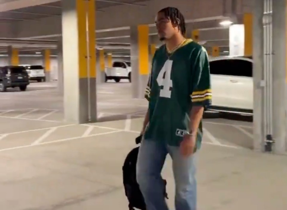 Love shows off a Favre journey on his way to the locker room