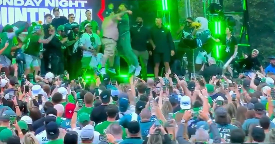 The pair leapt in the air and touched bellies in front of a raucous crowd
