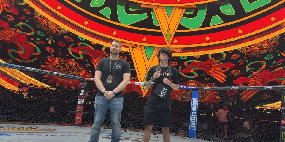 He posed for a photo in the center of the octagon