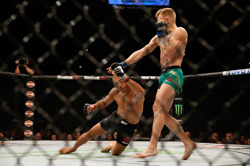 LAS VEGAS, NV - DECEMBER 12:  (R-L) Conor McGregor of Ireland punches Jose Aldo of Brazil in their UFC featherweight championship bout during the UFC 194 event inside MGM Grand Garden Arena on December 12, 2015 in Las Vegas, Nevada.  (Photo by Christian Petersen/Zuffa LLC/Zuffa LLC via Getty Images)