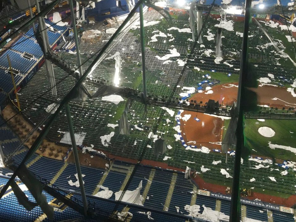 Drone images show the roof of the Rays' home field completely shredded