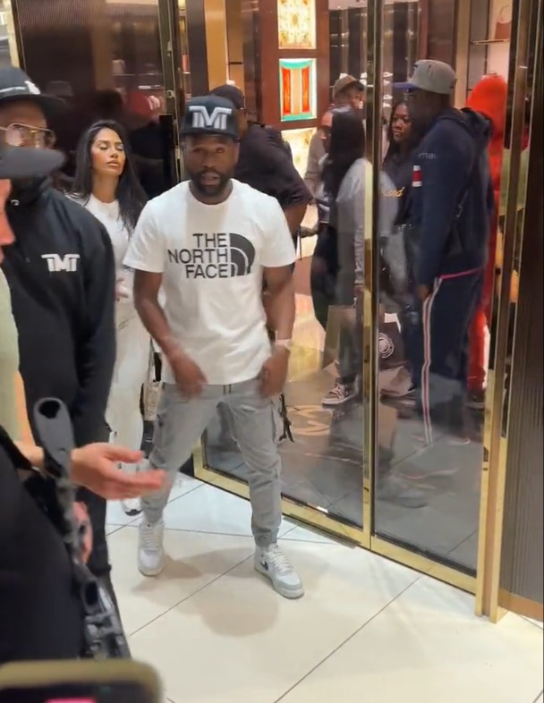 Mayweather was escorted out of the store with armed police at his aid