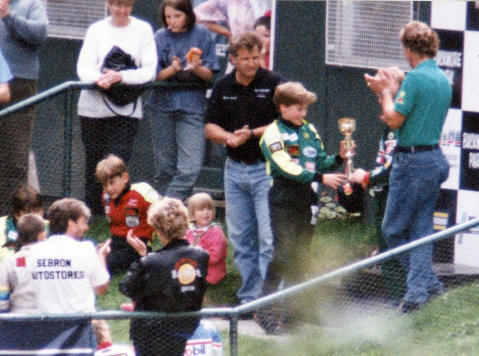 Prince William received a trophy from Herbert, watched by his mother, The Princess of Wales (black jacket) at Buckmore Park