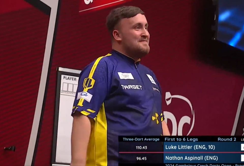 Littler smiled after he beat a tournament record in his win over Aspinall