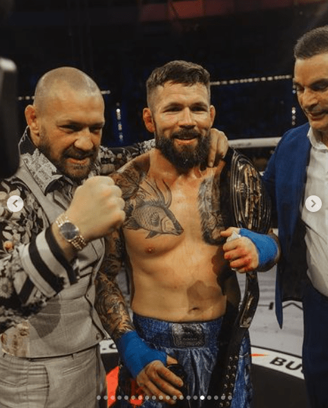 McGregor celebrated with David Mundell [left], who defended his middleweight belt for the third time, and BKFC President Feldman [right]