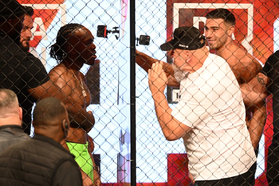 MANCHESTER, ENGLAND - OCTOBER 12: KSI and John Fury react during a KSI v Tommy Fury - Prime Card Press Conference at Manchester Central on October 12, 2023 in Manchester, England. (Photo by Ben Roberts Photo/Getty Images)