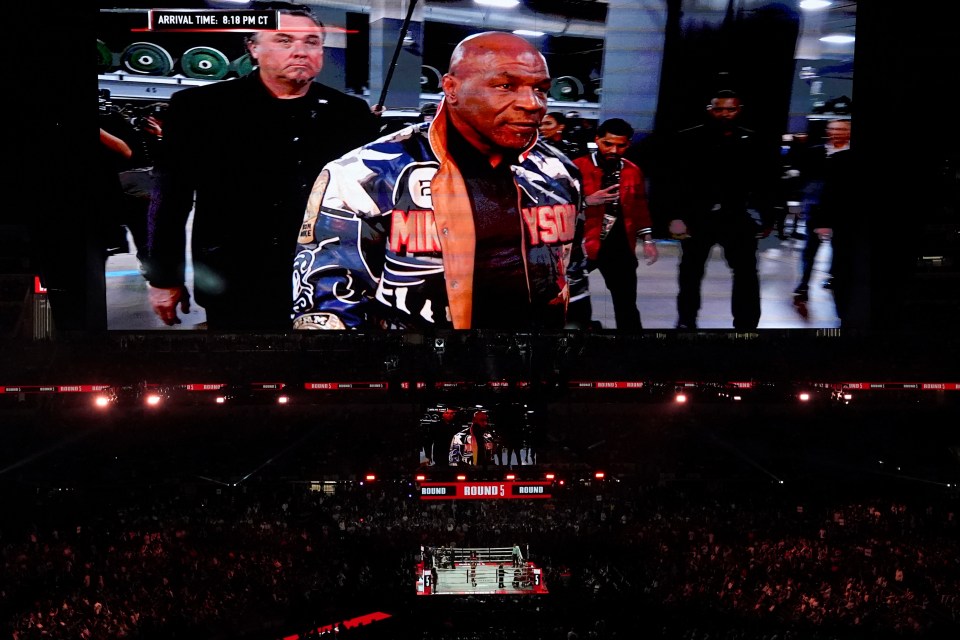 US retired pro-boxer Mike Tyson is seen on a jumbotron as he arrives for his heavyweight boxing bout with US YouTuber/boxer Jake Paul at The Pavilion at AT&T Stadium in Arlington, Texas, November 15, 2024. (Photo by TIMOTHY A. CLARY / AFP) (Photo by TIMOTHY A. CLARY/AFP via Getty Images)