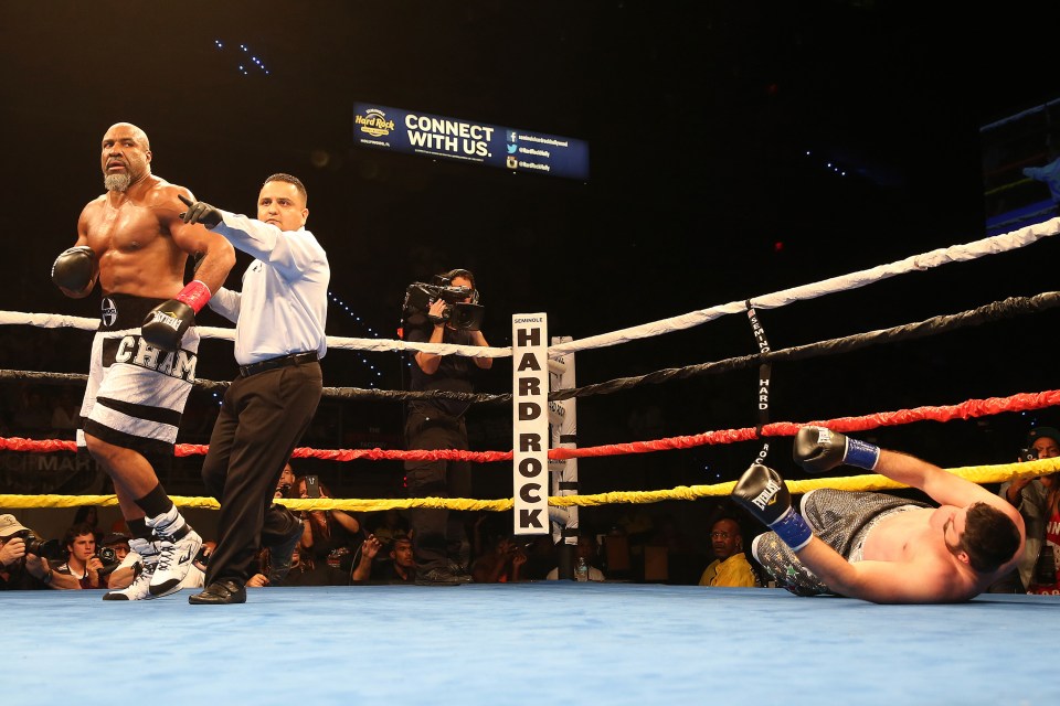 HOLLYWOOD , FL - SEPTEMBER 05: Shannon Briggs (L) walks to a neutral corner after the first knockdown of Mike Marrone during their heavyweight boxing match at the Hard Rock Hotel on September 5, 2015 in Hollywood, Florida. Briggs won the bout by second round KO.   (Photo by Alex Menendez/Getty Images)