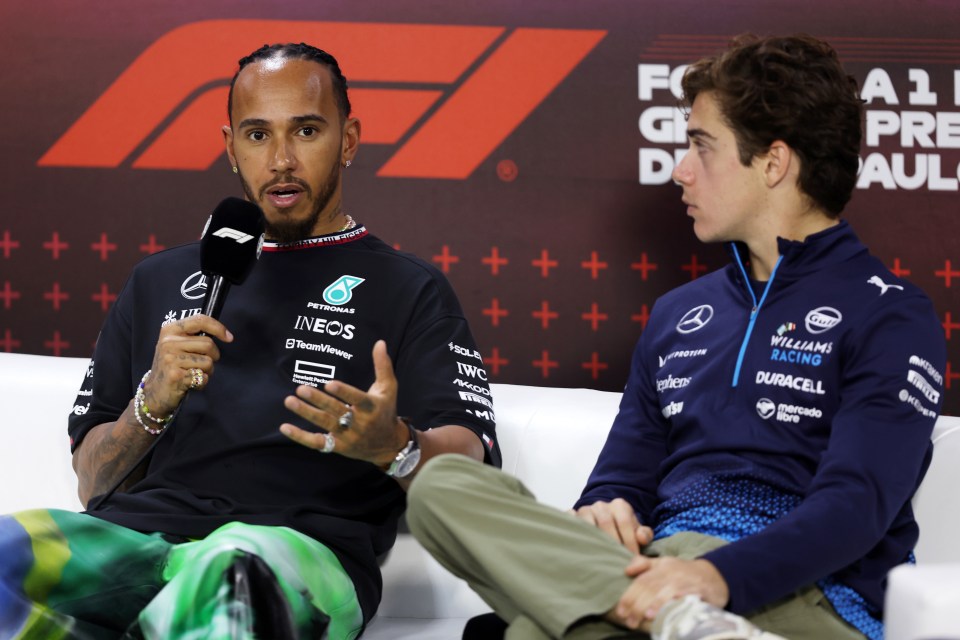 Lewis Hamilton and Franco Colapinto at a press conference.