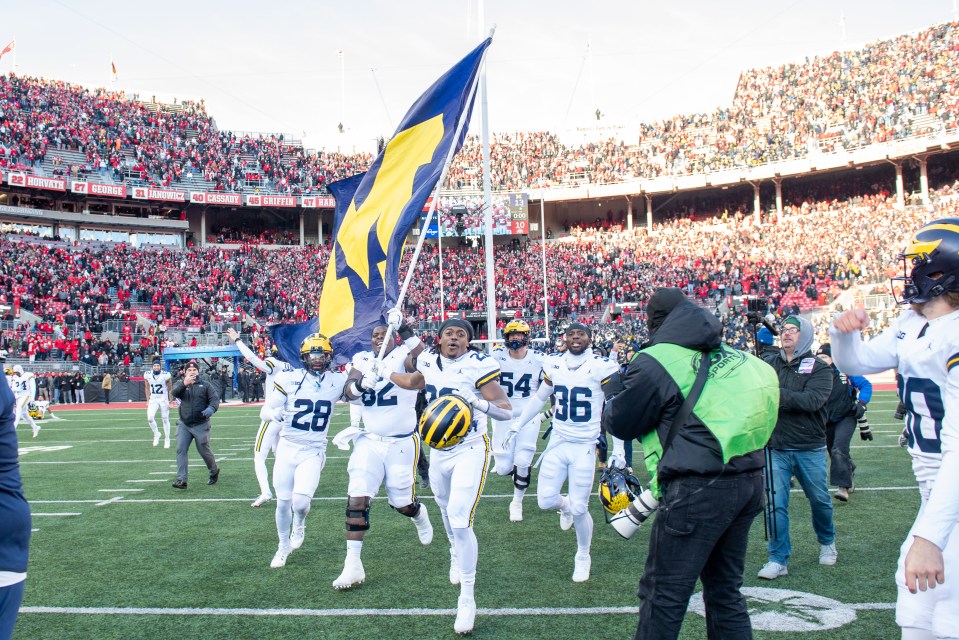 Michigan players tried to plant their flag after beating Ohio State on Saturday