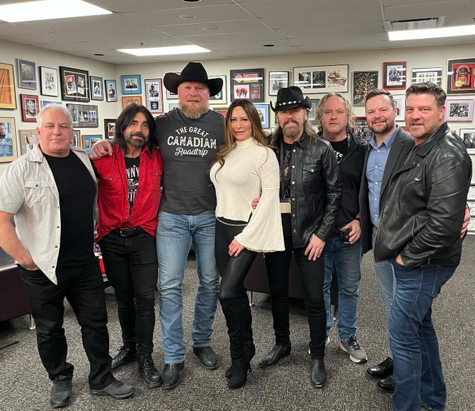 Rena 'Sable' Lesnar (middle) with husband, Brock after a music event