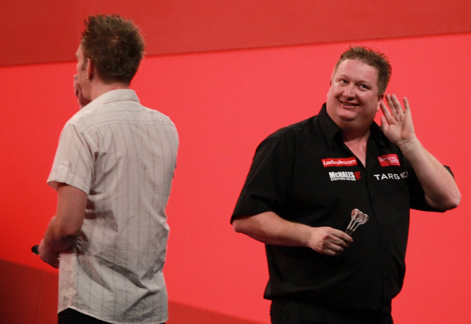 LONDON, ENGLAND - DECEMBER 17:  Colin Lloyd of England reacts to the crowd during his match with Andree Welge of Germany  during day two in the 2011 Ladbrokes.com World Darts Championship at Alexandra Palace on December 17, 2010 in London, England.  (Photo by Jan Kruger/Getty Images)