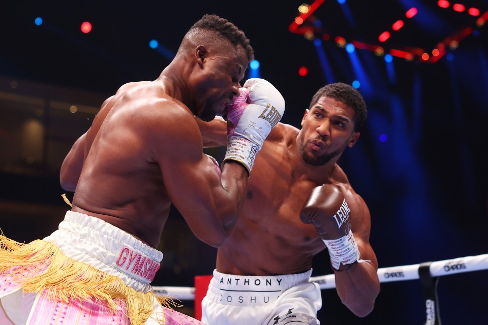 RIYADH, SAUDI ARABIA - MARCH 08: Anthony Joshua punches Francis Ngannou during the Heavyweight fight between Anthony Joshua and Francis Ngannou on the Knockout Chaos boxing card at the Kingdom Arena on March 08, 2024 in Riyadh, Saudi Arabia. (Photo by Richard Pelham/Getty Images)