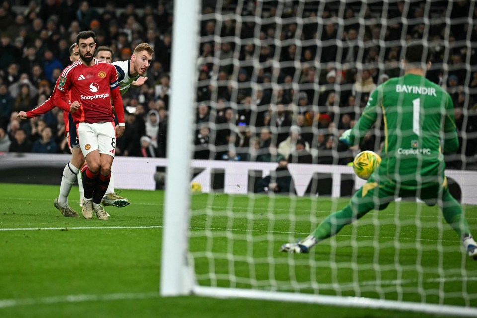 Tottenham Hotspur's Swedish midfielder #21 Dejan Kulusevski watches as Manchester United's Turkish goalkeeper #01 Altay Bayindir saves his shot during the English League Cup quarter-final football match between Tottenham Hotspur and Manchester United at the Tottenham Hotspur Stadium in London, on December 19, 2024. (Photo by Ben STANSALL / AFP) / RESTRICTED TO EDITORIAL USE. No use with unauthorized audio, video, data, fixture lists, club/league logos or 'live' services. Online in-match use limited to 120 images. An additional 40 images may be used in extra time. No video emulation. Social media in-match use limited to 120 images. An additional 40 images may be used in extra time. No use in betting publications, games or single club/league/player publications. /  (Photo by BEN STANSALL/AFP via Getty Images)