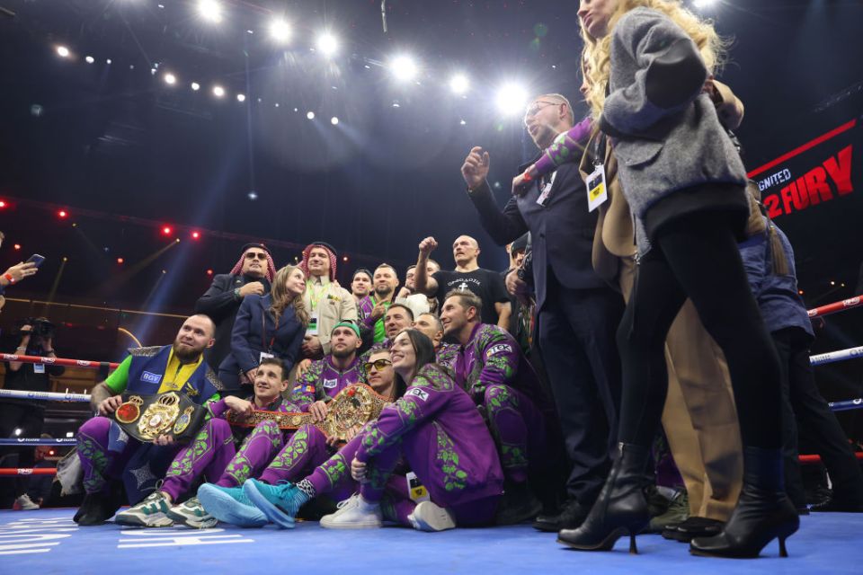 RIYADH, SAUDI ARABIA - DECEMBER 21: Oleksandr Usyk celebrates with the belts and his team following victory in the IBF, IBO, WBA, WBC and WBO Undisputed World Heavyweight titles' fight between Oleksandr Usyk and Tyson Fury as part of Oleksandr Usyk v Tyson Fury 2, Reignited card at Kingdom Arena on December 21, 2024 in Riyadh, Saudi Arabia. (Photo by Richard Pelham/Getty Images)