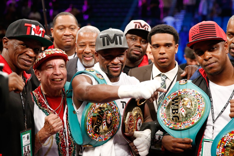 LAS VEGAS, NV - SEPTEMBER 12:  (L-R) Floyd Mayweather Sr., Rafael Garcia, Floyd Mayweather Jr. and DeJuan Blake pose in the ring following their WBC/WBA welterweight title fight against Andre Berto at MGM Grand Garden Arena on September 12, 2015 in Las Vegas, Nevada. Mayweather won by unanimous decision.  (Photo by Ezra Shaw/Getty Images)