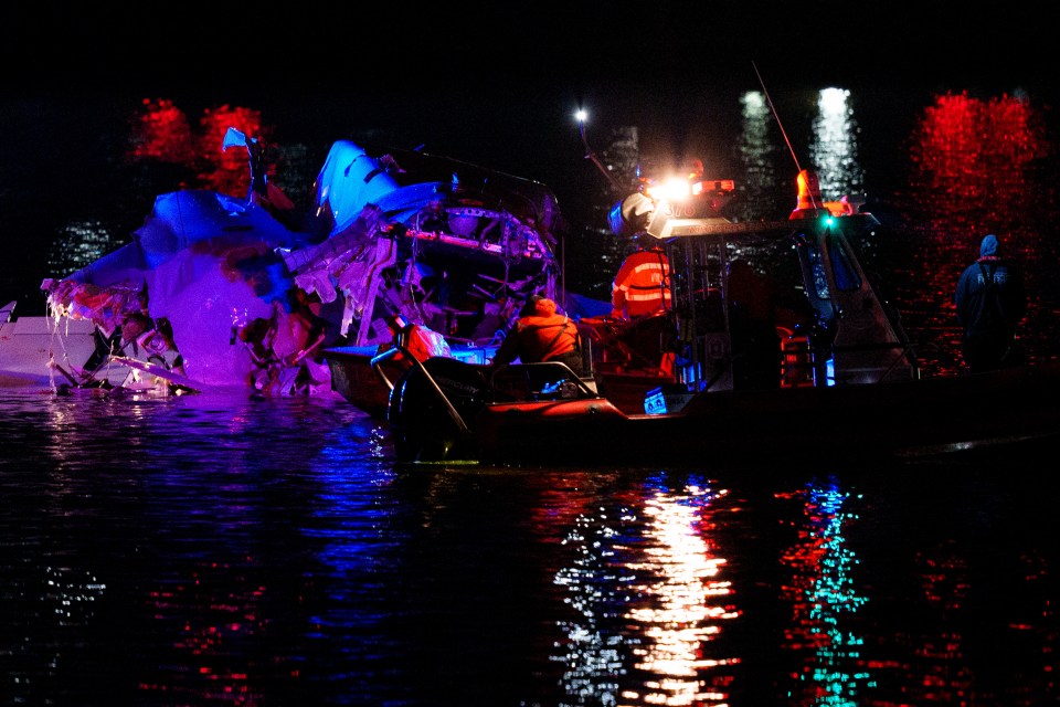 Emergency response units access airplane wreckage in the Potomac River