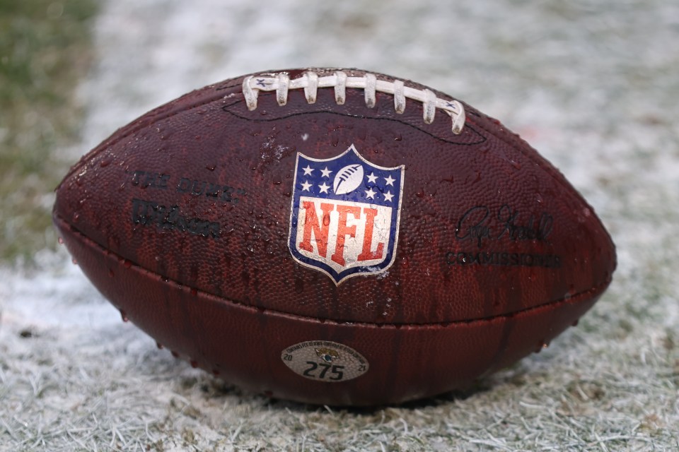 KANSAS CITY, MO - JANUARY 21: A view of a football with the NFL logo before an AFC divisional playoff game between the Jacksonville Jaguars and Kansas City Chiefs on January 21, 2023 at GEHA Field at Arrowhead Stadium in Kansas City, MO. (Photo by Scott Winters/Icon Sportswire via Getty Images)
