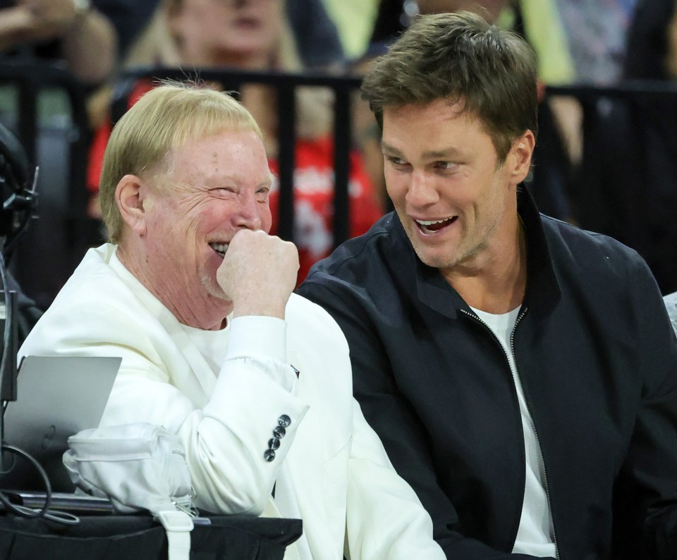 LAS VEGAS, NEVADA - OCTOBER 08: Las Vegas Raiders owner and managing general partner and Las Vegas Aces owner Mark Davis (L) and Tom Brady laugh as they attend Game One of the 2023 WNBA Playoffs finals between the Aces and the New York Liberty at Michelob ULTRA Arena on October 08, 2023 in Las Vegas, Nevada. NOTE TO USER: User expressly acknowledges and agrees that, by downloading and or using this photograph, User is consenting to the terms and conditions of the Getty Images License Agreement. (Photo by Ethan Miller/Getty Images)