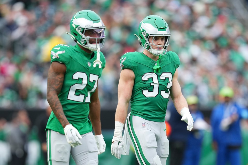 PHILADELPHIA, PENNSYLVANIA - DECEMBER 29: Quinyon Mitchell #27 and Cooper DeJean #33 of the Philadelphia Eagles look on against the Dallas Cowboys at Lincoln Financial Field on December 29, 2024 in Philadelphia, Pennsylvania. (Photo by Mitchell Leff/Getty Images)
