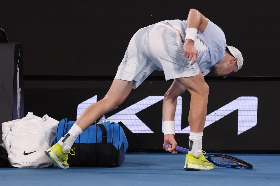 Britain's Jack Draper smashes his racquet after losing the third set against Australia's Aleksandar Vukic during their men's singles match on day six of the Australian Open tennis tournament in Melbourne on January 17, 2025. (Photo by DAVID GRAY / AFP) / -- IMAGE RESTRICTED TO EDITORIAL USE - STRICTLY NO COMMERCIAL USE -- (Photo by DAVID GRAY/AFP via Getty Images)