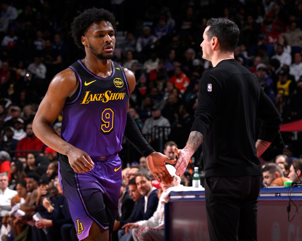 PHILADELPHIA, PA - JANUARY 28: Bronny James #9 and Head Coach JJ Redick of the Los Angeles Lakers high five during the game against the Philadelphia 76ers on January 28, 2025 at the Wells Fargo Center in Philadelphia, Pennsylvania NOTE TO USER: User expressly acknowledges and agrees that, by downloading and/or using this Photograph, user is consenting to the terms and conditions of the Getty Images License Agreement. Mandatory Copyright Notice: Copyright 2025 NBAE (Photo by David Dow/NBAE via Getty Images)