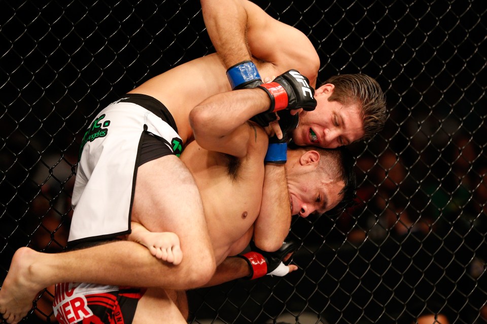 SAN JOSE, CA - JULY 26:  (L-R) Brian Ortega attempts to secure a rear choke submission against Mike De La Torre in their featherweight bout during the UFC Fight Night event at SAP Center on July 26, 2014 in San Jose, California.  (Photo by Josh Hedges/Zuffa LLC/Zuffa LLC via Getty Images)