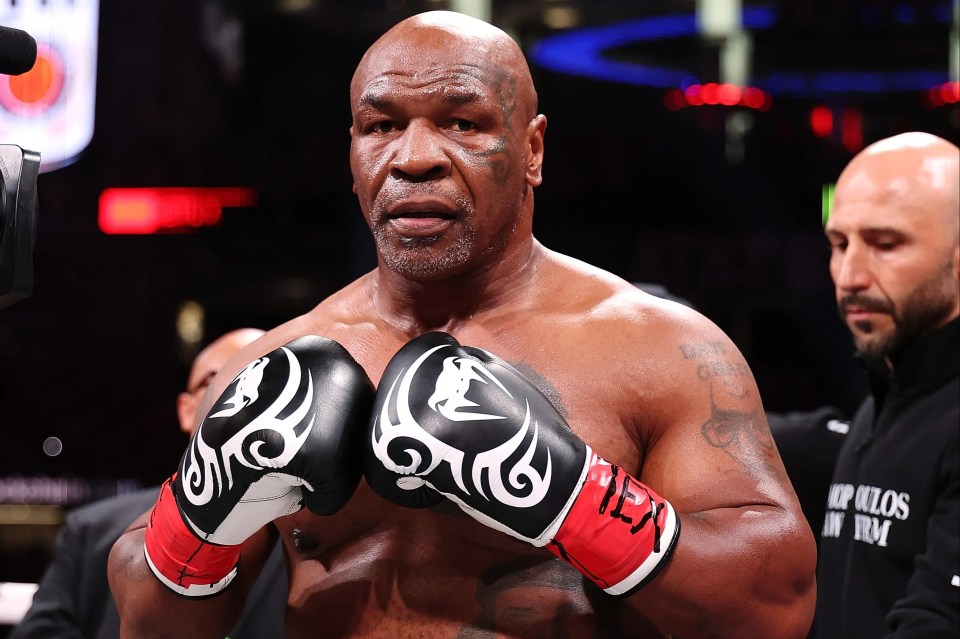 ARLINGTON, TEXAS - NOVEMBER 15: Mike Tyson fights during LIVE On Netflix: Jake Paul vs. Mike Tyson at AT&T Stadium on November 15, 2024 in Arlington, Texas. (Photo by Al Bello/Getty Images for Netflix © 2024)